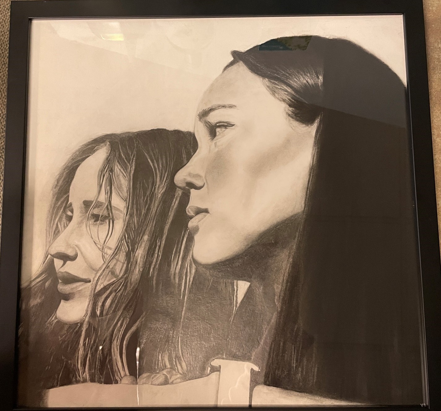 A charcoal and graphite drawing of two people from the next up.