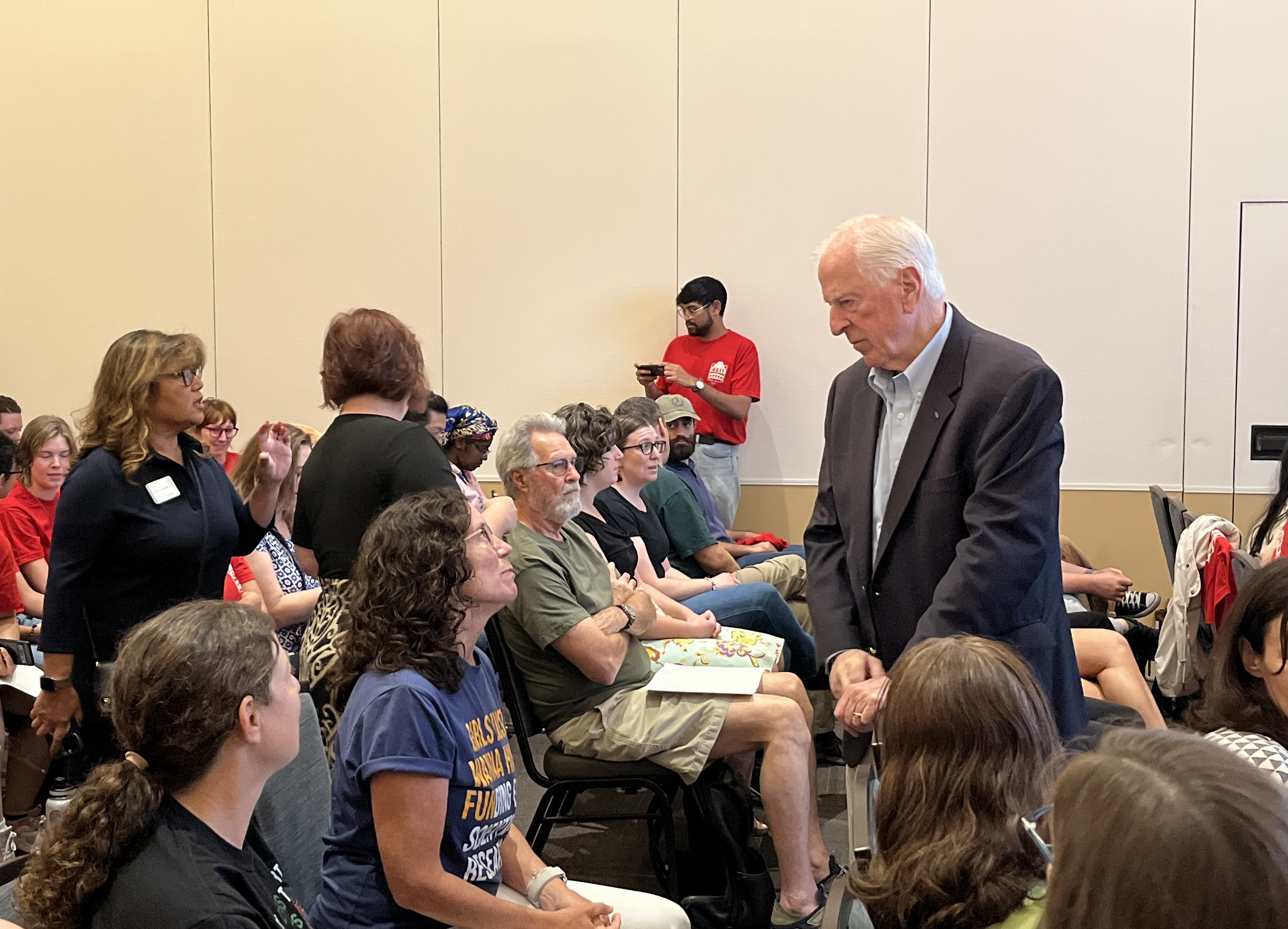 Rep. Thompson listens to a community member's concerns at a listening session at UC Davis on federal cuts to research funding